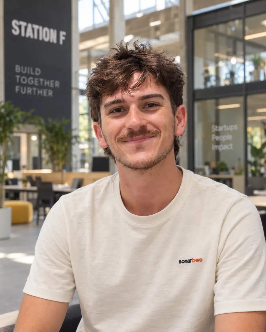 Mathis Estève at Station F, in a Sonarbee T-shirt.